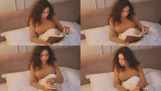 女人晚上在床上看书高清在线视频素材下载