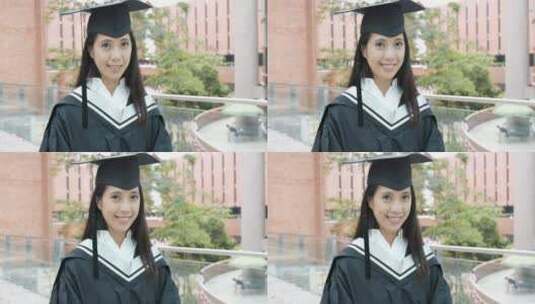 女生穿着毕业礼服微笑的看向镜头高清在线视频素材下载