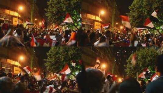 中埃及开罗夜间集会上抗议者挥舞旗帜燃放烟花高清在线视频素材下载