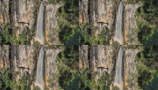 悬崖边飞流直下的瀑布高清在线视频素材下载