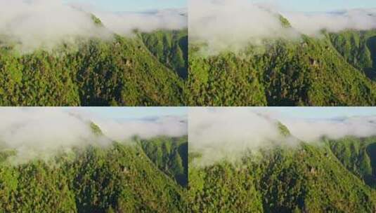 鸟瞰云雾流云下绿色的山脉高清在线视频素材下载