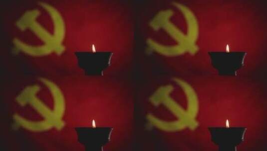 蜡烛烛光映照下鲜艳的红色中国共产党党旗高清在线视频素材下载