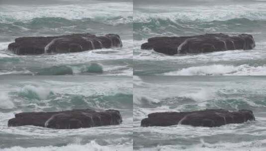 海浪覆盖着平坦的岩石高清在线视频素材下载