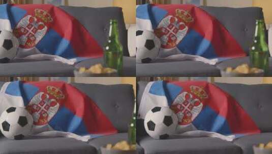 沙发上的旗帜和足球高清在线视频素材下载