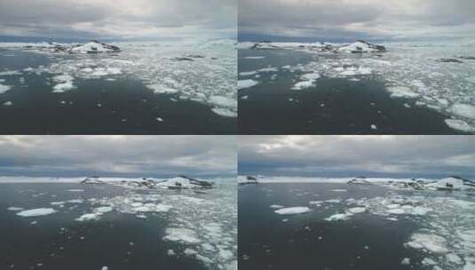 企鹅在南极洲海洋跳跃。航拍。高清在线视频素材下载