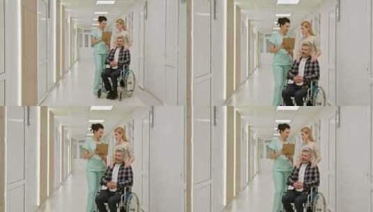 医院轮椅上的中年男子与护士和同伴高清在线视频素材下载