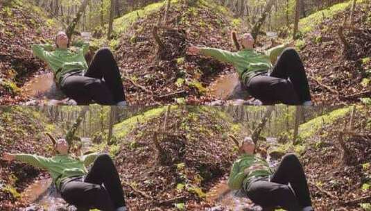 一个躺在森林树枝上的女人高清在线视频素材下载