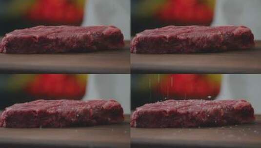 厨师在肉上撒盐高清在线视频素材下载