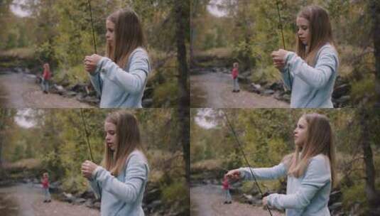 女孩在森林的河里钓鱼高清在线视频素材下载