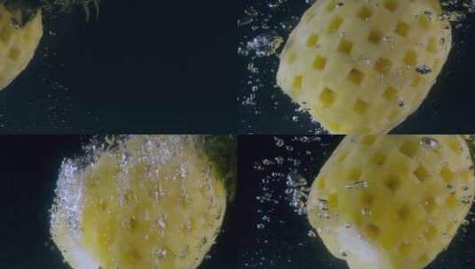 水果菠萝视频慢镜头落入水中的黄色菠萝水泡高清在线视频素材下载
