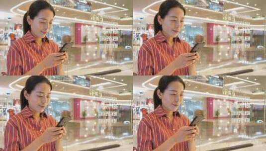 中国女性在商场内挑选衣服购物高清在线视频素材下载