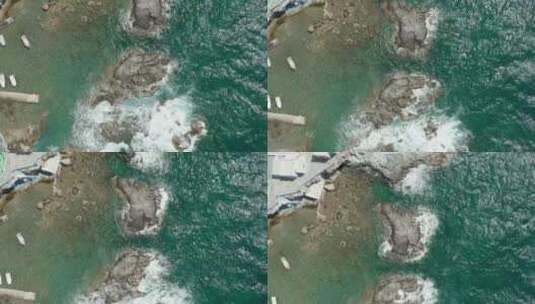 海浪冲破旅游港口的岩石海岸高清在线视频素材下载