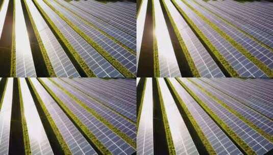 阳光下的太阳能农场面板；空中无人机高清在线视频素材下载