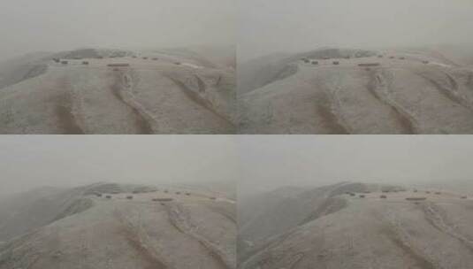 航拍冬日飞雪下的夏河高原4k高清在线视频素材下载