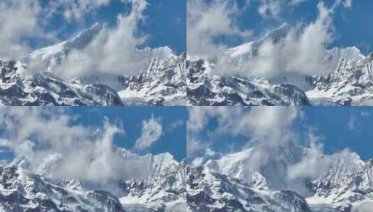 蓝天白云下壮观的雪山高清在线视频素材下载
