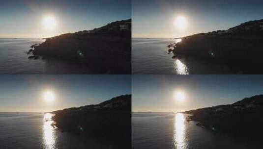 日落时大海和山丘的高清在线视频素材下载