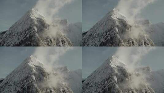 云雾中的雪山雪松森林雪景山顶高峰高清在线视频素材下载