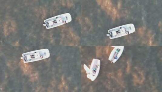 漂浮在美国庞恰特雷恩湖浑浊水中的船只的自上而下视图。-空中高清在线视频素材下载