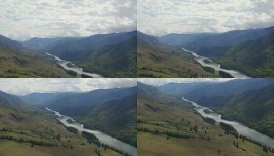 在白云和蓝天下的AK-Kem山谷绿色山脉之间的Katun河高清在线视频素材下载