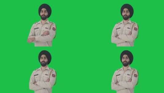 自信的锡克教警察双手交叉站立的肖像绿屏高清在线视频素材下载