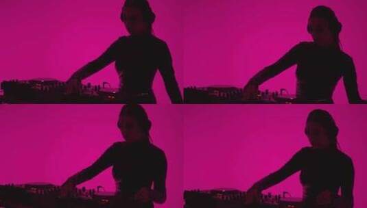 戴耳机的美丽女人在夜总会跳舞，由现代DJ高清在线视频素材下载