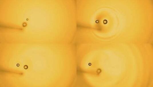 水中的金黄色油分子流动高清在线视频素材下载