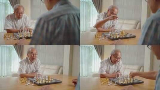 亚洲老年男性和朋友一起下棋，在家享受退休生活。高清在线视频素材下载