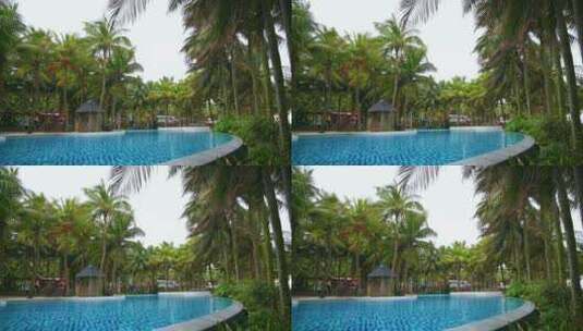 海南三亚椰林与蓝色透明游泳池高清在线视频素材下载