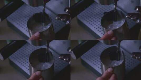 浓缩咖啡机牛奶起泡的特写镜头高清在线视频素材下载
