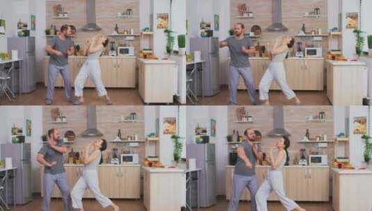 有趣的夫妇在厨房跳舞高清在线视频素材下载