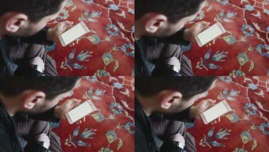 穆斯林男子用手机阅读古兰经高清在线视频素材下载