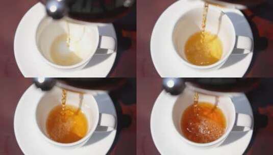 黄色的茶水倒进杯子高清在线视频素材下载