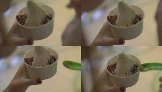 吃美味的冷冻酸奶冰淇淋的特写镜头高清在线视频素材下载