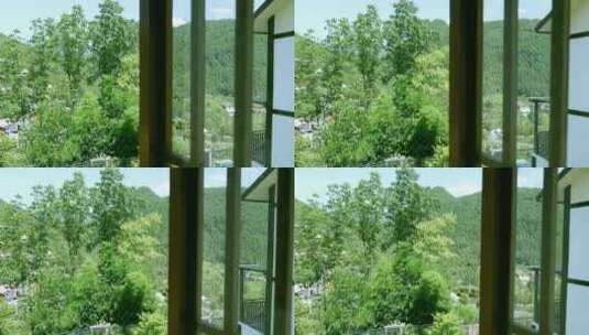 4K升格实拍度假酒店窗外郁郁葱葱的山林高清在线视频素材下载