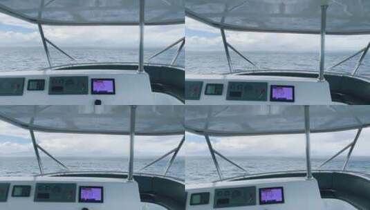 钓鱼船在波涛汹涌的大海上雨中航行高清在线视频素材下载
