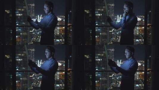 男人站在摩天大楼看平板高清在线视频素材下载