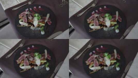 黑盘子上的烤牛肉高清在线视频素材下载
