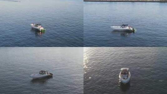 游客乘坐快艇在宁静的海景在夏季日落。-空中轨道高清在线视频素材下载