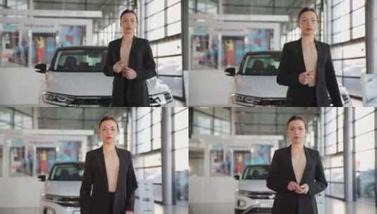 现代汽车沙龙中一位快乐的年轻女售货员站在高清在线视频素材下载