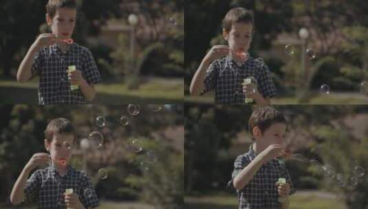 小男孩吹出五彩缤纷的泡泡高清在线视频素材下载