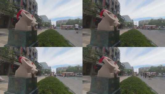 威海十二属相街牛雕像延时4K高清在线视频素材下载