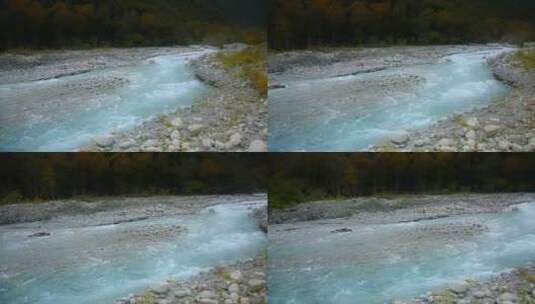 小溪视频顺着山坡流淌的蓝色小溪高清在线视频素材下载