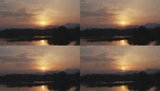日落夕阳湖畔延时晚霞布满天空高清在线视频素材下载