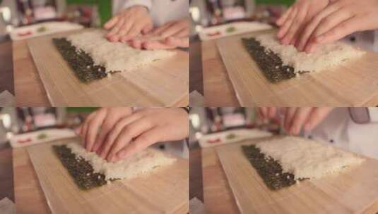 厨师们在做寿司卷的时候用手压米饭高清在线视频素材下载