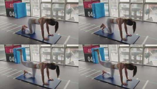 一位女青年在健身房锻炼身体高清在线视频素材下载
