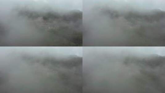 山间笼罩在云海下面的村庄高清在线视频素材下载