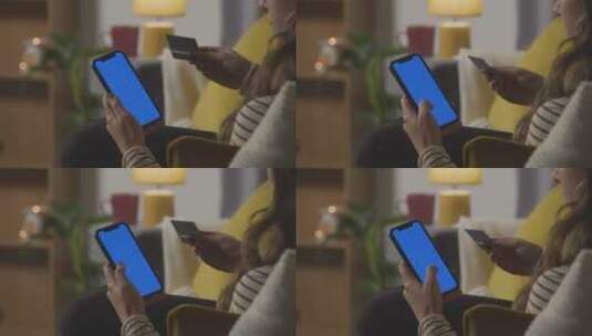 使用蓝屏手机在线购物的女性特写镜头高清在线视频素材下载