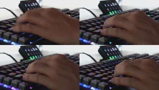 玩家打字和使用彩色键盘的手，一个无法辨认的人在玩的特写高清在线视频素材下载
