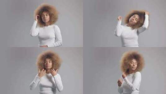 混合种族黑人女子与大非洲头发在工作室单独高清在线视频素材下载