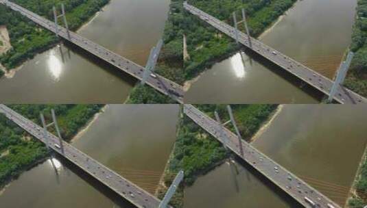 用ci从大河上的柏油路混凝土桥或高速公路的无人机俯视图高清在线视频素材下载